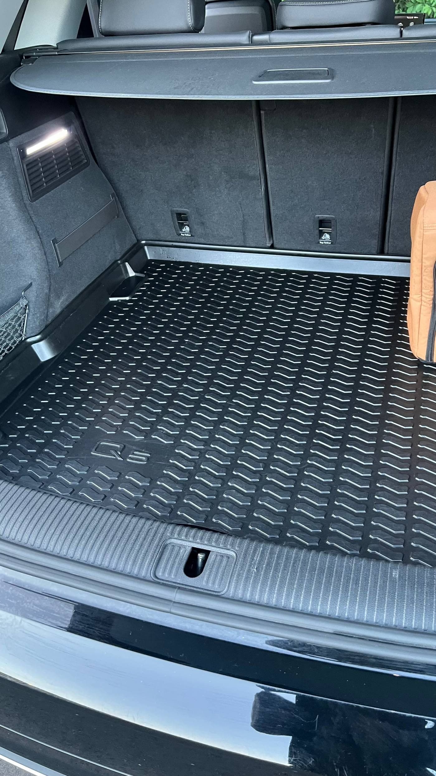 Clean Audi Q5 trunk and cargo area with spotless rubber mat
