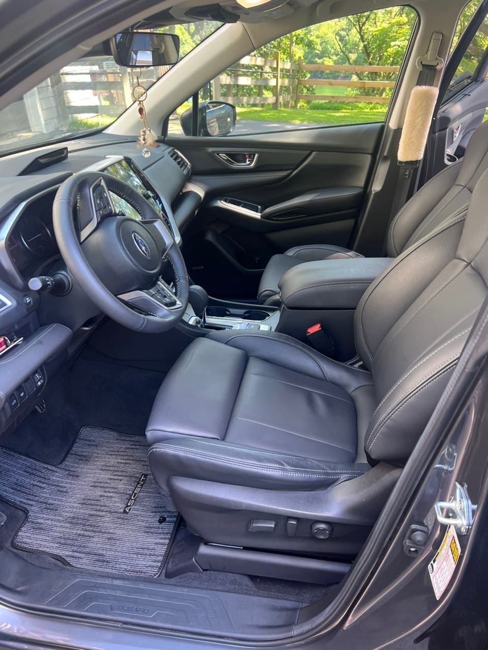 Freshly cleaned Subaru interior with spotless seats and a detailed dashboard